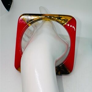 Neon orange and amber swirl square lucite bangle size 8.  Vintage 60’s